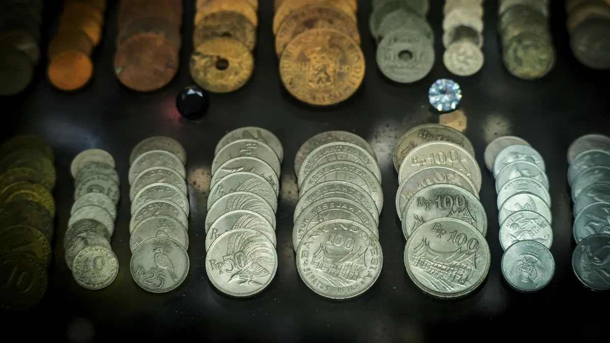 Enterprise Value vs Market Cap: Debt Changes the Price A stack of coins representing the cash and debt that turn market cap into enterprise value