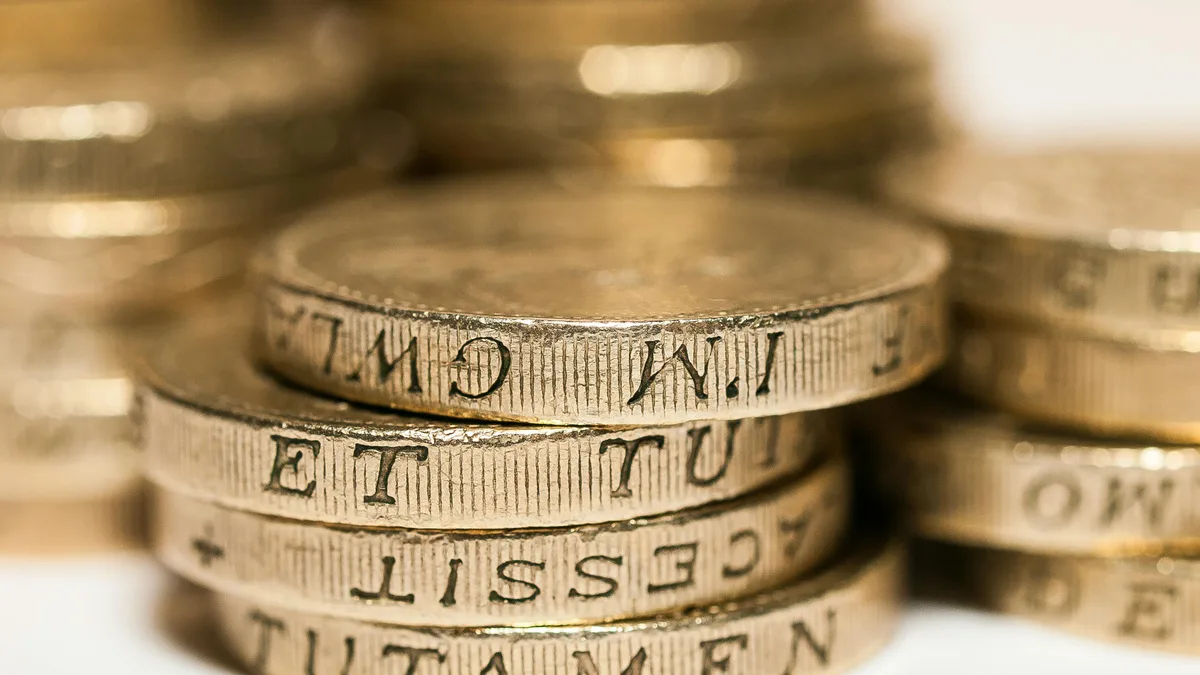 How to Build a Diversified Portfolio (Step by Step) A stack of coins spread into several smaller piles, spreading money across assets that do not all rise and fall together