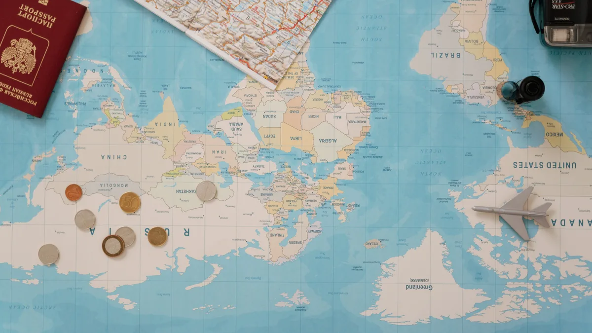 Tax Residency and the 183-Day Rule Explained A globe with currency symbols, a globally mobile investor whose tax residency decides where worldwide income and gains are taxed